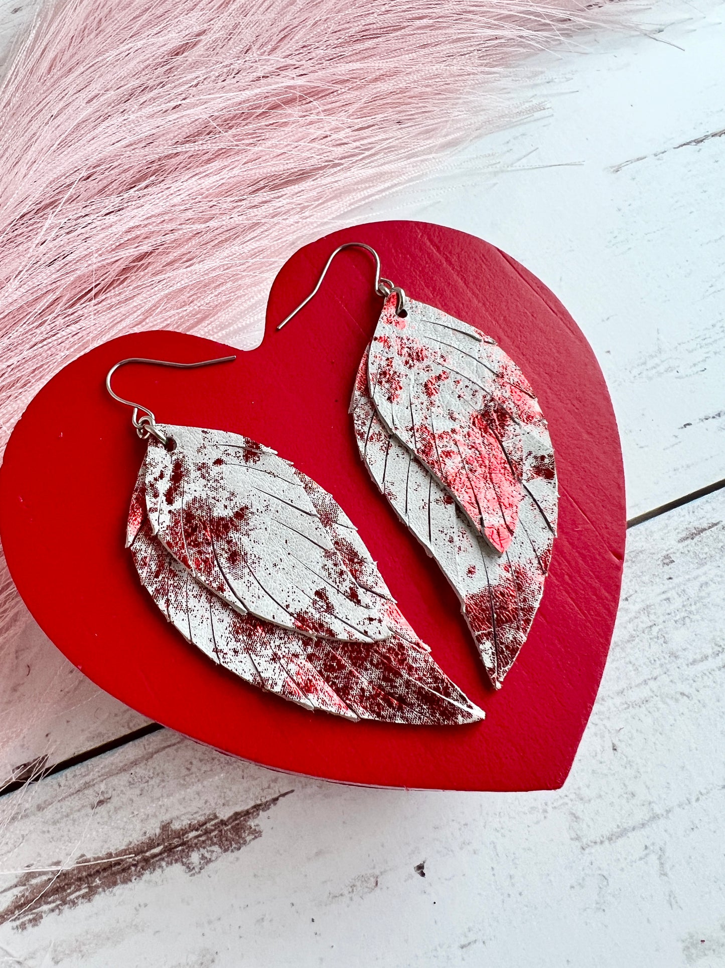 Red Metallic Splash on White Lady May Feathers