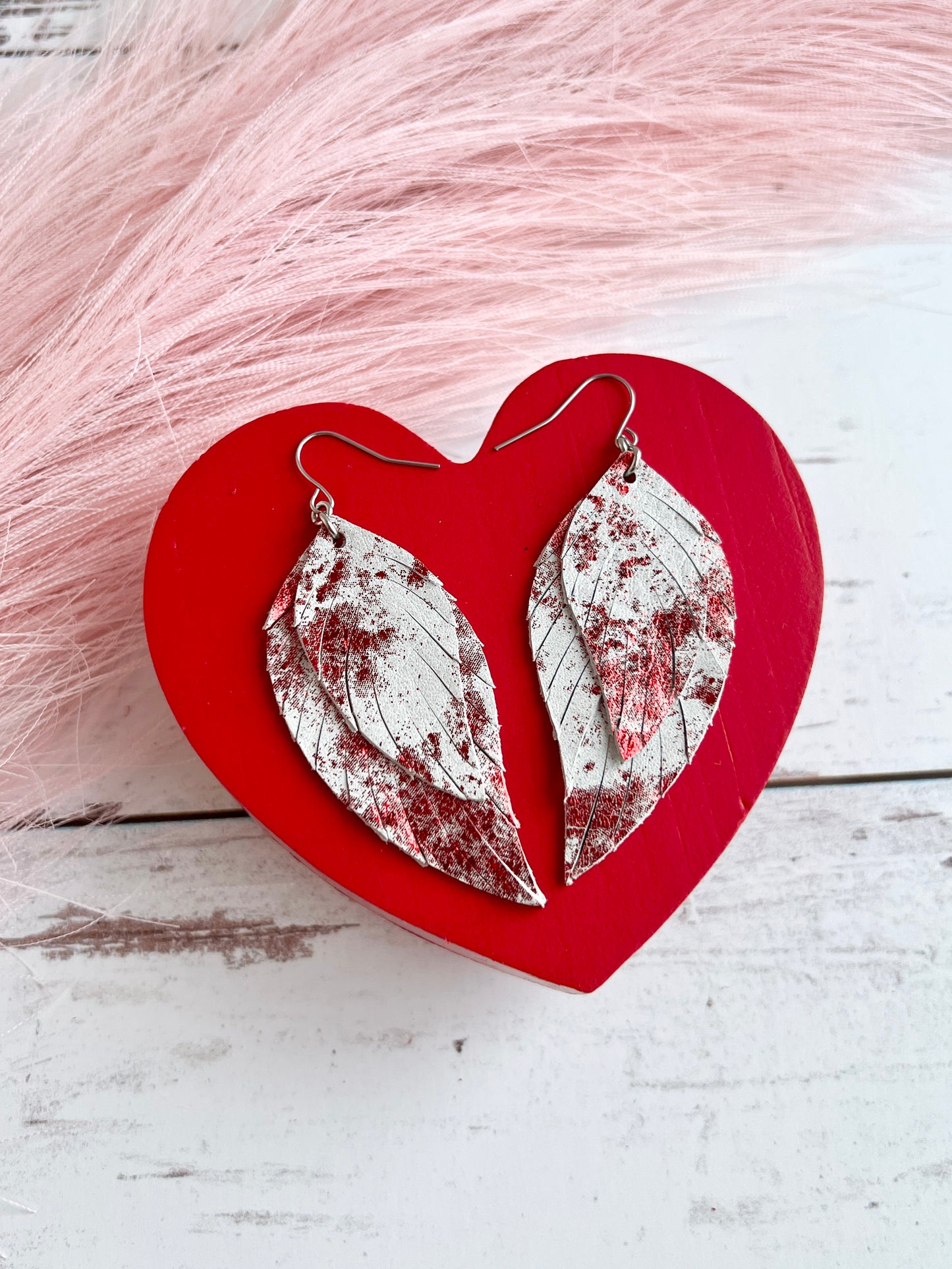 Red Metallic Splash on White Lady May Feathers