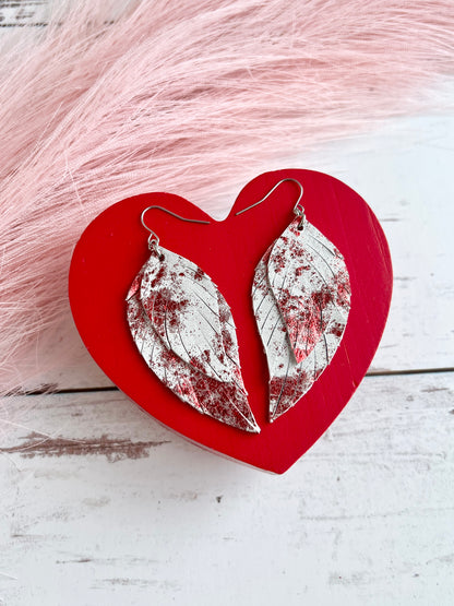 Red Metallic Splash on White Lady May Feathers