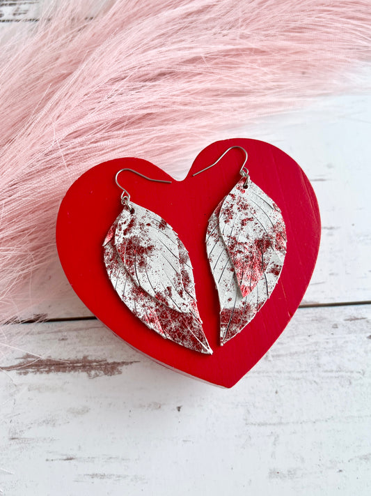 Red Metallic Splash on White Lady May Feathers